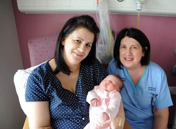 The late Rae King pictured with baby Faye Hunt and her mother Mariea in the Altnagelvin maternity unit in 2016.