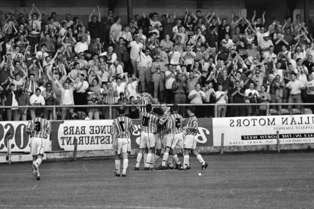 Harry McCourt is mobbed by his teammates after opening the scoring against Lokomotiv Sofia in the Cup Winners Cup tie at Brandywell Stadium in 1995.