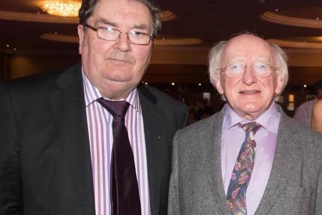 John Hume with President Michael D. Higgins in 2014.