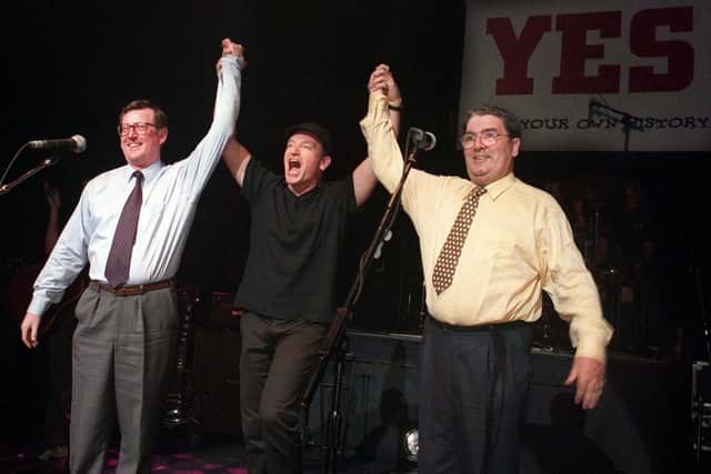 PACEMAKER BELFAST 19/05/98 Unionist leader David Trimble, SDLP leader John Hume and Bono and U2 pictured together on stage at the Waterfront hall in Belfast this evening for a concert to promote a YES vote in the referendum on Friday