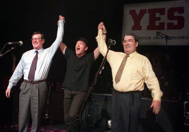PACEMAKER BELFAST 19/05/98 Unionist leader David Trimble, SDLP leader John Hume and Bono and U2 pictured together on stage at the Waterfront hall in Belfast this evening for a concert to promote a YES vote in the referendum on Friday