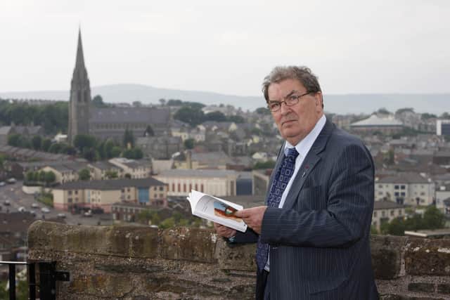 PACEMAKER PRESS BELFAST 29-05-2008: Nobel Peace Prize winner John Hume reads a book titled 'Britian & Ireland Lives Entwined II' before the launch of the book at the Verbal Arts Centre in Londonderry, Northern Ireland.