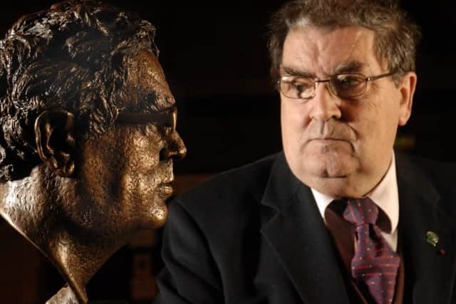 John Hume pictured with the bronze of himself by Derry Born Sculptor John Sherlock in St. Columbs College. Photo: John Harrison.