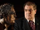 John Hume pictured with the bronze of himself by Derry Born Sculptor John Sherlock in St. Columbs College. Photo: John Harrison.