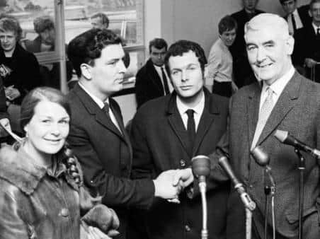 John Hume shakes hand with Eddie McAteer in 1969. Included are his wife Pat Hume and Eamonn McCann.