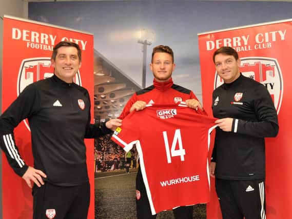 Derry City boss, Declan Devine and assistant manager, Kevin Deery alongside new signing, Jake Dunwoody who has been unable to play for his new side until his 14 day quarantine period is completed.
