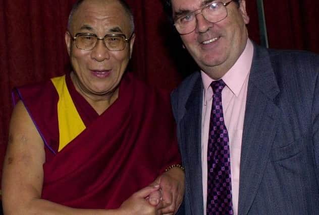 The Dalai Lama with the late John Hume.