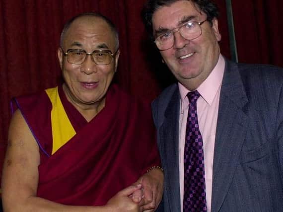 The Dalai Lama with the late John Hume.