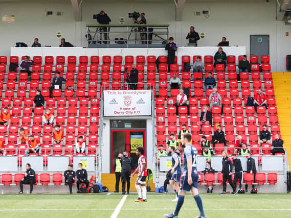 THE GROUND OF SILENCE . .  A sparsely populated Mark Farren stand at Brandywell last Friday night as Derry City played a league game for the first time since March 6th. (Picture by Kevin Moore)