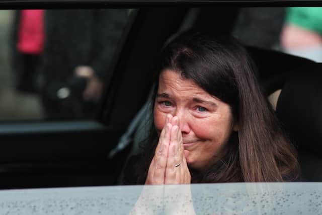 Press Eye - Belfast - Northern Ireland - 5th August 2020 - Photo by Lorcan Doherty / Press Eye The Funeral of the late John Hume at St. Eugene's Cathedral, Derry. John Hume's daughter Dr. Aine Abbott acknowledges the the support of people as they applaud the passing funeral cortege.