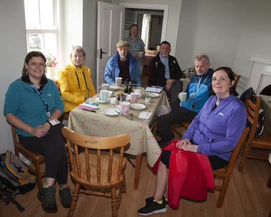 Enjoying a well-earned cup of tea before the final leg are from left, Sue Divin (DCSDC) , Anne Magowan, Maolcholaim Scott, Maureen Curran, Fr Oâ€TMHagan, Bishop Alan McGuckian, and Geraldine Oâ€TMConnor, The Churches Trust. (Photos: Jim McCafferty Photography)