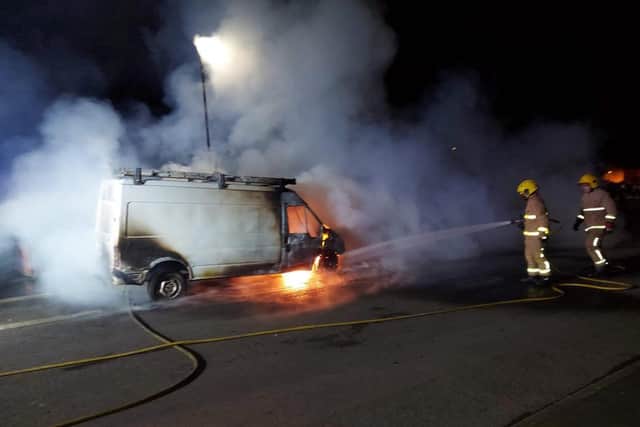 Firefighters deal with a burning van in Galliagh last night.