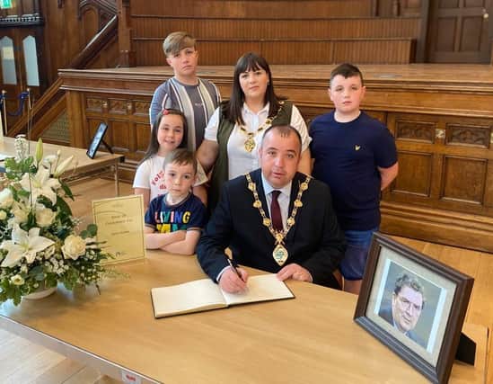 Signing the Book of condolence with my wife Cheryl and Children Cian, Shane, Mary-Kate and Ben.