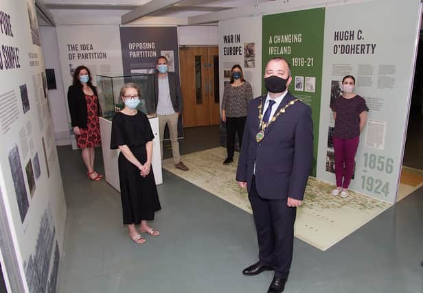 Mayor Brian Tierney at the launch of Dividing Ireland Exhibition in the Tower Museum. From left, are Bernadette Walsh, archivist, Roisin Doherty, Museum Services, David Lewis, Nerve Centre, Sue Divin, Peace IV, and Fiona Lafferty, Peace IV. (Photo - Tom Heaney, nwpresspics)
