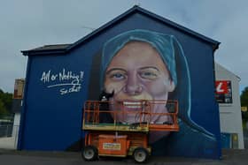 UV artist Ray Bonner working on a mural in honour of Sister Clare Crockett, on a gable wall in the Brandywell area, on Wednesday afternoon last. The mural will be unveiled at 6pm on Sunday evening next. DER2033GS - 005