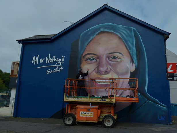 UV artist Ray Bonner working on a mural in honour of Sister Clare Crockett, on a gable wall in the Brandywell area, on Wednesday afternoon last. The mural will be unveiled at 6pm on Sunday evening next. DER2033GS - 005