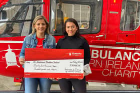 Rebecca and Christa Vogel with adonation to the Air Ambulance Charity in memory of ther brother Willis who died in a road traffic collision in May.