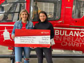 Rebecca and Christa Vogel with adonation to the Air Ambulance Charity in memory of ther brother Willis who died in a road traffic collision in May.