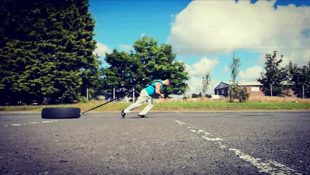 Jay Kiernan training for the tyre pull