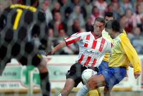 Gary Beckett attempts to weave his way past the Apoel Nicosia defence during the second leg at Brandywell Stadium.