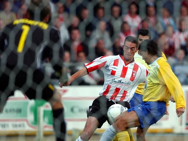 Gary Beckett attempts to weave his way past the Apoel Nicosia defence during the second leg at Brandywell Stadium.