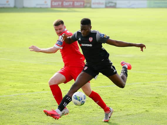 Derry City's Ibrahim Meite holds off Shelbourne's Alex O'Hanlon. Picture by Kevin Moore/Maiden City Images