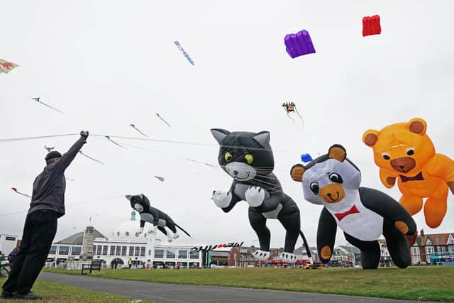 Giant kites are flown by expert kite flyers during the Whitley Bay Kite Festival in North Tyneside