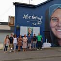 Family and friends of Sister Clare Crockett pictured at the a mural dedicated to her memory , officially unveiled in Deanery Street on Sunday evening last. DER2034GS - 009