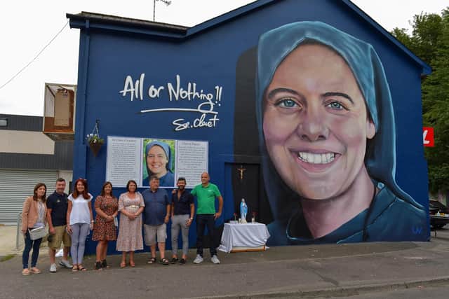 Family and friends of Sister Clare Crockett pictured at the a mural dedicated to her memory , officially unveiled in Deanery Street on Sunday evening last. DER2034GS - 009
