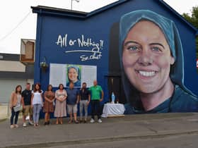 Family and friends of Sister Clare Crockett pictured at the a mural dedicated to her memory , officially unveiled in Deanery Street on Sunday evening last. DER2034GS - 009