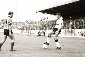 ‘Gazza’ shows off his skills as Derry’s Paul Magee approaches cautiously.