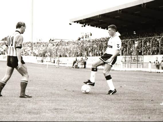 ‘Gazza’ shows off his skills as Derry’s Paul Magee approaches cautiously.