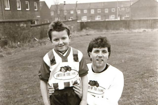 Former Derry City winger, Joe Hanrahan pictured with a young Derry City fan at the Showgrounds.