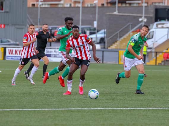 Derry striker, Ibrahim Meite gets behind the Cork defence before striking the post.