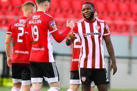 SUPER SUBS . . . James Akintunde is congratulated for his goal against Cork City by Stephen Mallon.