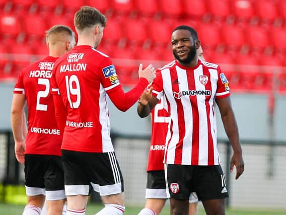 SUPER SUBS . . . James Akintunde is congratulated for his goal against Cork City by Stephen Mallon.