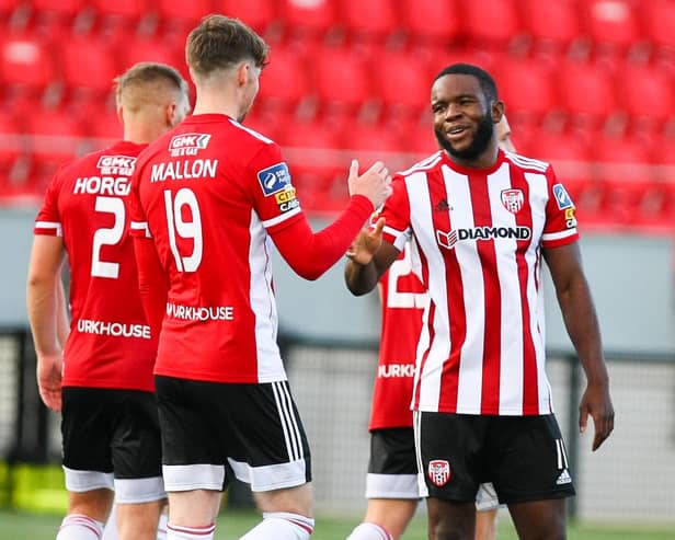 SUPER SUBS . . . James Akintunde is congratulated for his goal against Cork City by Stephen Mallon.