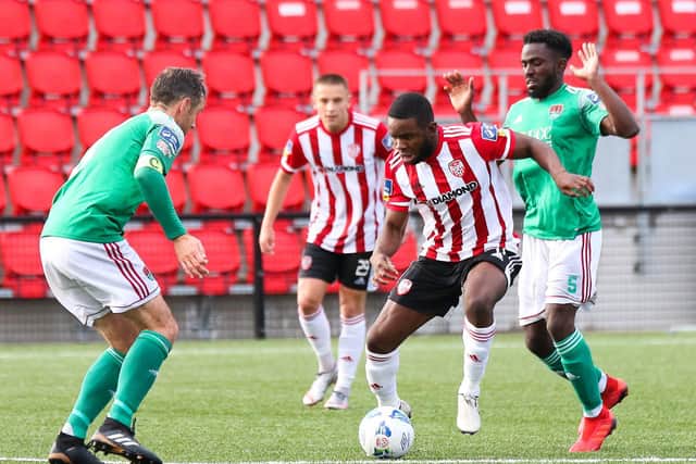 Derry City forward, James Akintunde takes on Cork captain, Alan Bennett during Friday's game at Brandywell.