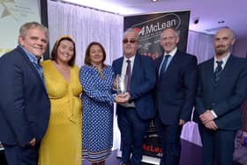 Richard Moore, Children In Crossfire, receives the Lifetime Achievement Award, from Mayor of Derry City and Strabane Colr. Michaela Boyle, at the Derry Journal People of the Year Awards held recently in the Waterfoot Hotel. Included in the photograph are Adrian Logan, compere, Niamh Moore, Paul McLean, managing director, BetMcLean, principle sponsor, and Brendan McDaid, Editor, Derry Journal. DER3619GS – 081