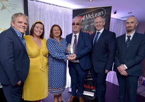 Richard Moore, Children In Crossfire, receives the Lifetime Achievement Award, from Mayor of Derry City and Strabane Colr. Michaela Boyle, at the Derry Journal People of the Year Awards held recently in the Waterfoot Hotel. Included in the photograph are Adrian Logan, compere, Niamh Moore, Paul McLean, managing director, BetMcLean, principle sponsor, and Brendan McDaid, Editor, Derry Journal. DER3619GS – 081