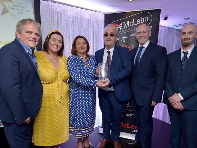 Richard Moore, Children In Crossfire, receives the Lifetime Achievement Award, from Mayor of Derry City and Strabane Colr. Michaela Boyle, at the Derry Journal People of the Year Awards held recently in the Waterfoot Hotel. Included in the photograph are Adrian Logan, compere, Niamh Moore, Paul McLean, managing director, BetMcLean, principle sponsor, and Brendan McDaid, Editor, Derry Journal. DER3619GS – 081