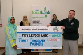 Farzana Sharmin, Rabia Kar, Rashida Rauf and Fouzia Naz (absent from photo) from the North West Islamic Association were present to hand over a cheque for £3,000 to James McMenamin manager of the Foyle Foodbank. The donation, this year, was raised through a Ramadan charity fasting challenge on the NWIA Facebook and through other donations. DER2035GS - 027
