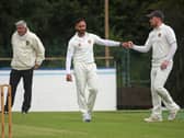 Brigade’s Iftikhar Hussain is congratulated by David Barr