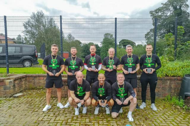 The cyclists pictured with their medals and their personalised glass plaques presented by the school.