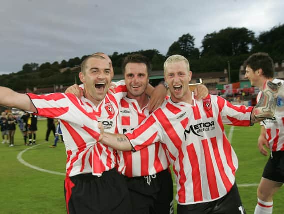 Sean Hargan, the hero in Gothenburg, celebrates the Uefa Cup victory at Brandywell with teammates, Darren Kelly and Stephen O'Flynn.