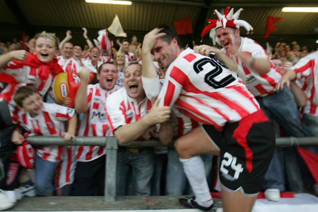 Derry City defender, Darren Kelly jumps into the crowd after City defeated Gothenburg at Brandywell.