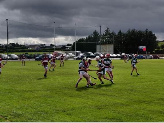 A midfield tussle between Banagher and Na Magha at St. Colm's Park Drum