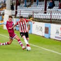 Derry City's Adam Hammill takes on the Drogheda defence during the Extratime.ie FAI Cup Second Round fixture.
