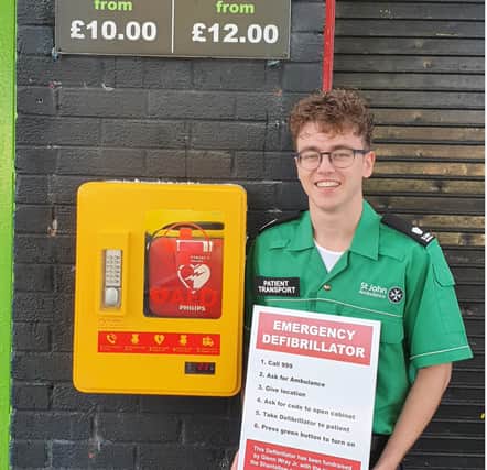 Glenn Wray, pictured with the new defibrillator.
