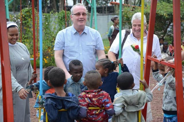 Richard with children in Ethiopia.